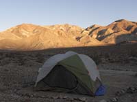 23-tent_with_setting_sun_illuminating_mountain