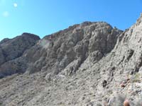 34-looking_back_to_summit_to_left_and_break_in_wall_to_right_we_traversed