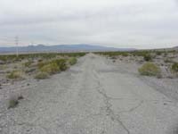 03-a_little_more_than_one_mile_there_is_a_paved_road-June_Bug_Mine_Rd-looking_W