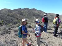 20-Sierra_and_Kenny_pointing_to_Gass_Peak_over_a_mile_away