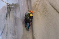 58-Ernesto_in_tight_squeeze_smooth_drainage_while_rappelling