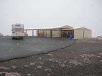 48-covered_area_to_get_on_the_bus-tent_for_Indians_selling_jewelry