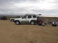 80-Ed_and_Luba_packing_up-they_and_Ed_were_the_most_comfortable_last_night-winds_still_rocked_their_vehicles