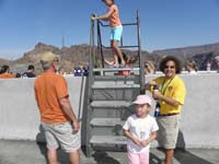 24-Jerry_Seeler,fellow_guide,volunteering_helping_people_over_the_wall_to_the_walkway-several_custom_ladders