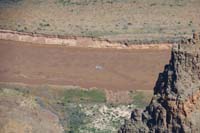 11-zoom_view_of_swift_flowing_river_with_river_rafter-erosion_from_flood_last_summer