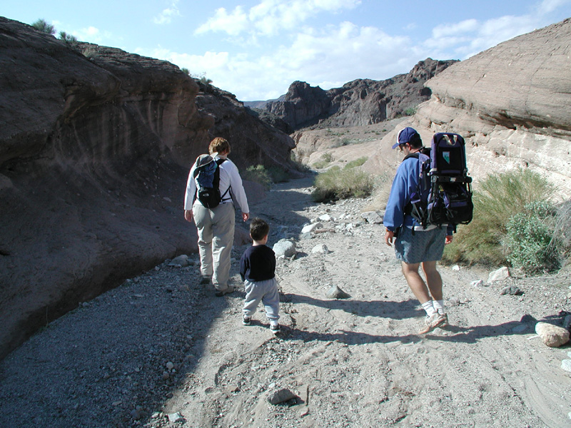 02-Kristi_Toby_and_Toby_hiking_in_a_wash