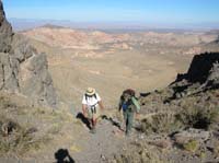 12-Joel_and_Greg_with_scenic_views_from_saddle