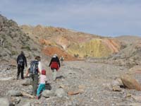 05-group_in_wash_approaching_colorful_mudstone