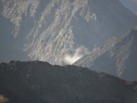 09-odd_lone_wispy_cloud_between_mountains_in_the_distance_seen_from_ridgeline