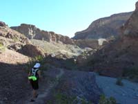 045-Peppe_leading_the_way_via_worn_path_up_canyon