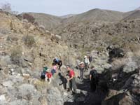 07-group_hiking_and_climbing_over_rocks_in_another_drainage