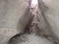 32-Ed_and_Kenny_in_slot_canyon-to_their_right_is_a_short_class_3_climb