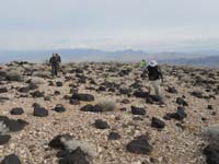 14-group_hiking_through_interesting_rock_plateau-from_Joel