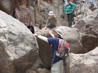 24-Daddy_giving_instruction_to_Kenny_how_to_climb_down_the_rock