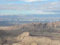 18-scenic_view_from_peak-looking_W-Las_Vegas_Strip-Red_Rock_with_high_peaks_capped_by_clouds