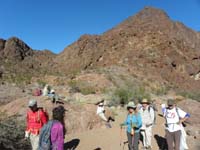 49-group_together_in_Gold_Strike_Canyon-our_peak_was_beyond_that_big_peak