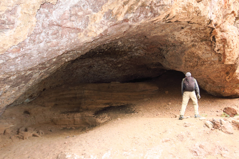 07-Andy_checking_out_cave_near_river