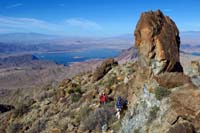 15-looking_back_to_Ed_and_Luba_with_pretty_scenery_and_Lake_Mead