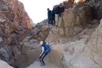 65-Kenny_checking_out_the_unscrambleable_dry_waterall-group_traverses_along_exposed_section