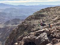 19-Luba,me,and_Ed_admiring_terrain,discussing_possible_way_down_for_future_exploratory-from_Laszlo