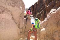 67-setting_up_for_rappel_8-kudos_to_original_webbing_fed_through_holes,not_us