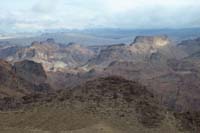 16-zoom_scenic_view_to_NE_across_river-Fortress_Butte_to_right