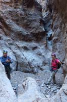 43-looking_back_to_Brett_and_Patti_with_3rd_rappel_in_background_while_I'm_about_to_start_4th_rappel