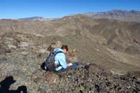 22-Kenny_signing_the_registry_for_Ham_Peak_with_Peanut_and_Butter_Peaks_in_background