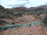 49-interesting_strip_of_blue_rock_with_red_rock_in_background