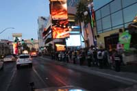 107-crowds_waiting_to_cross_the_road,most_are_wearing_masks