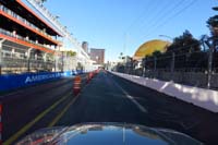 176-racetrack-Koval_Rd_approaching_turn_to_the_Sphere_grandstands-access_road_to_R