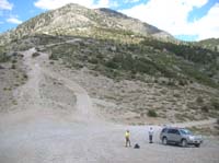 52-Harlan_Bill_and_car_with_Willow_Peak_in_background