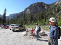 02-Kenny_Baba_Poppy_at_beginning_of_hike-new_parking_lot-Kenny_sits_where_old_pit_toilet_existed
