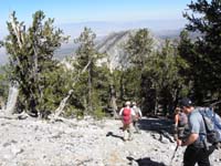 47-group_heading_down_towards_cliff_in_foreground_then_left_and_down_different_route_via_drainage