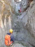 34-Luba_rappeling_as_seen_from_below-to_save_time_Richard_is_at_the_next_rappel_setting_up