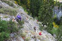 08-looking_back_at_group_heading_up_steep_slope_and_scrambling