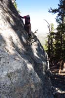 15-Luba_scrambling_up_tough_steep_limestone_with_exposure