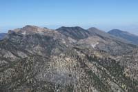 32-scenic_view_from_peak-looking_NW-zoom_view_of_McFarland,Bonanza,Sisters_Peaks