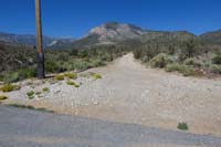 03-TinCanAlley_TH-start_trail_by_heading_W_on_dirt_road