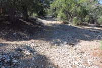 57-TinCan-DR_TJ-Tin_Can_Alley_L_and_R,dirt_road_connector_continues_uphill