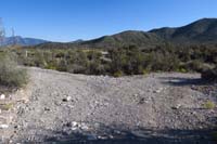 75-TelePhnCynRd_WP-dirt_road_jct,L-continues_Telephone_Cyn_Rd,R-leads_to_washed_out_dirt_road_to_Kyle_Canyon_Rd