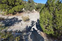 27-crossing_a_wash_which_has_eroded_the_trail,continued_forward