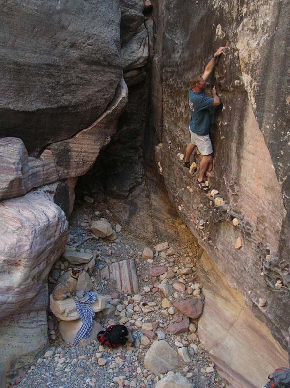 009-Rodney_putting_a_rock_in_the_highest_hole