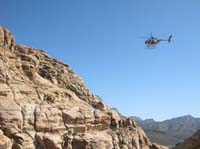 23-SAR_helicopter_entering_canyon_next_to_us_trying_to_find_a_place_to_land