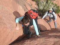 29-Carroll_using_those_rock_climbing_skills_while_Ken_watches_over_her