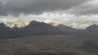 11-panoramic_views_of_Red_Rock_Mountains_with_storm_approaching_and_sun_peaking_through_clouds