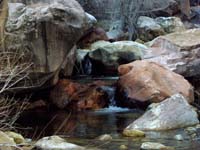 06-colorful_rocks_with_small_waterfall-lots_of_water_on_this_hike