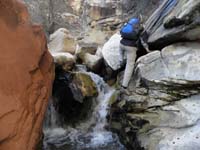 19-Larry_climbing_around_the_waterfall-slippery_so_be_careful-the_water_is_cold