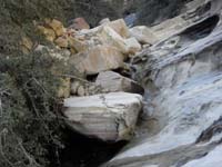 27-interestingly_stacked_rocks_and_water_cascading_down_them