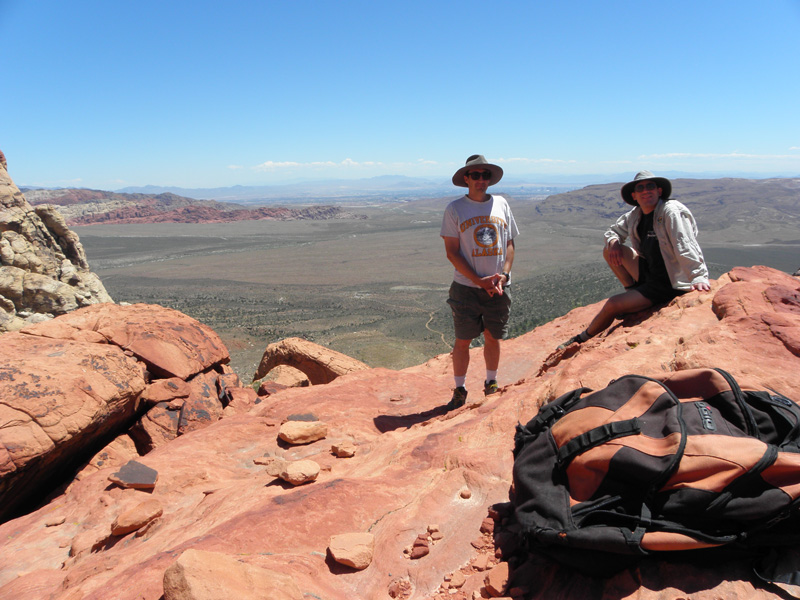 24-Mike_and_I_on_Mescalito_Peak-Calico_Hills_in_background_left_and_Las_Vegas_Strip_between_us